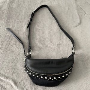 This is a crossbody bag, and could be used as a nicer Fanny pack.